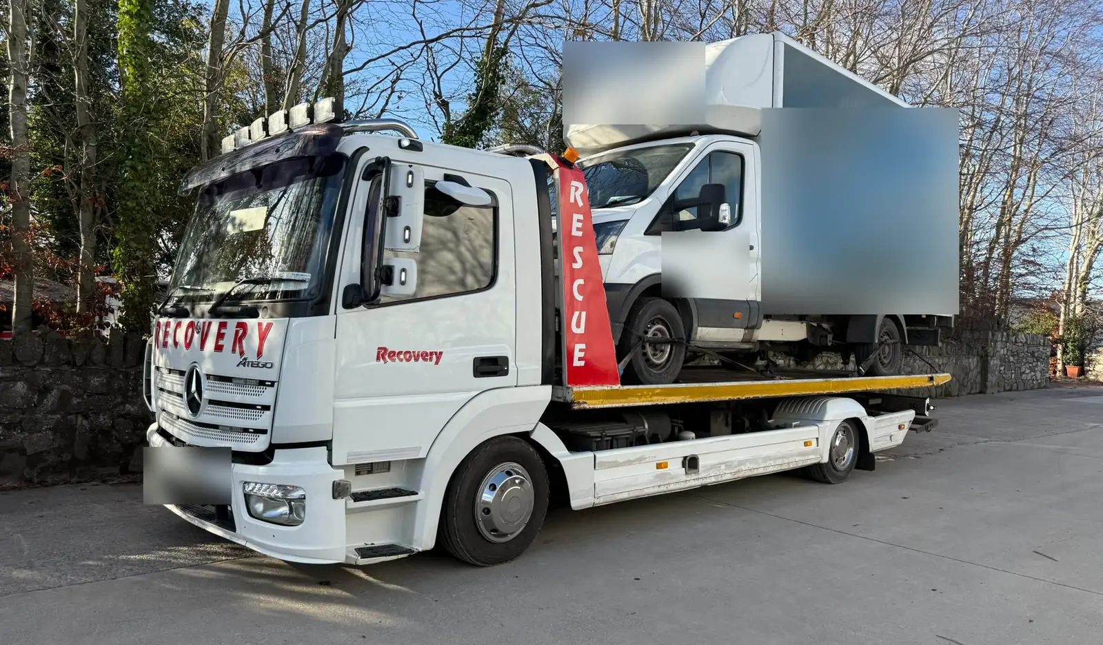 Recovery CC Mercedes Atego tow truck carrying a Luton box van in Dublin