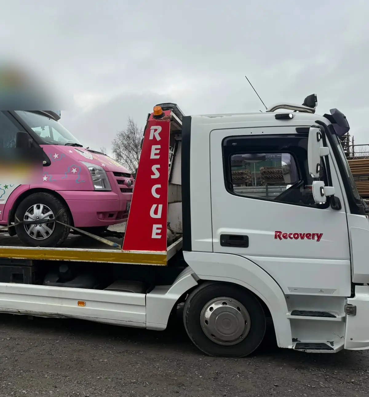 Recovery CC flatbed tow truck carrying a pink van, van towing in Dublin